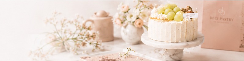 A soft DECI PASTRY cake studio banner